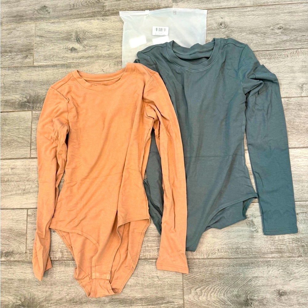 Two Bodysuits size medium NEW
